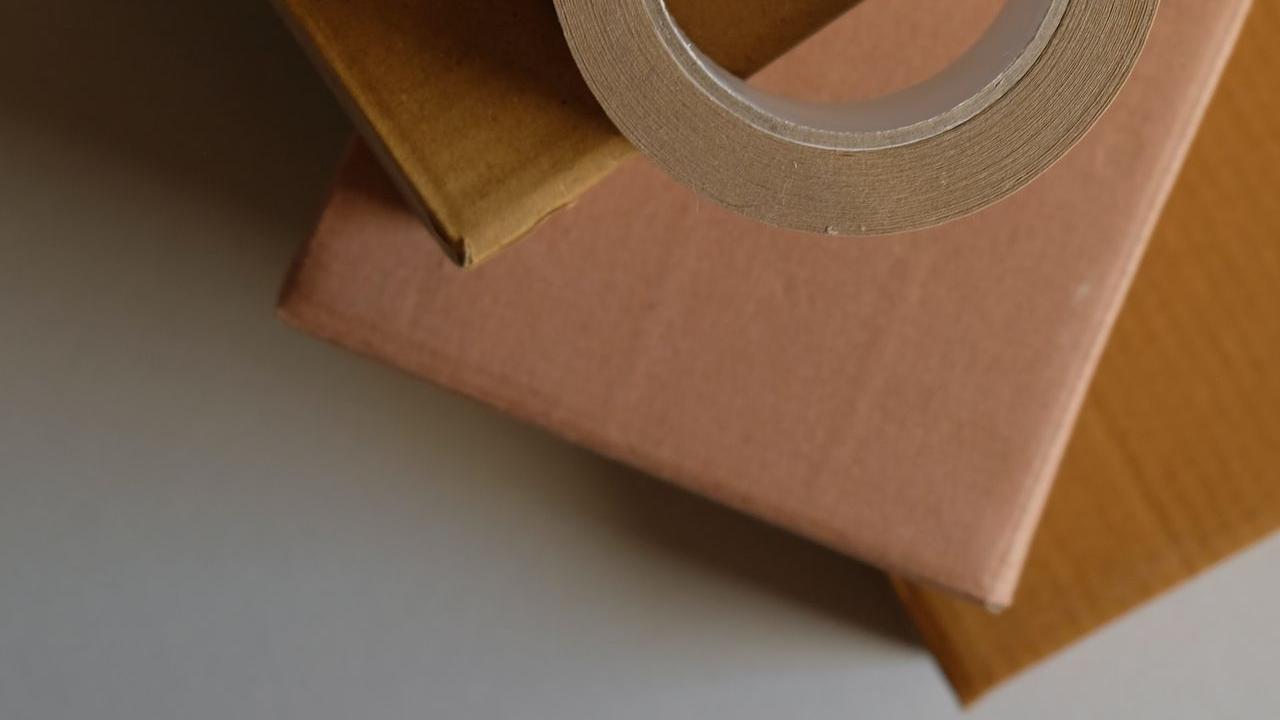 brown cardboard box on white table