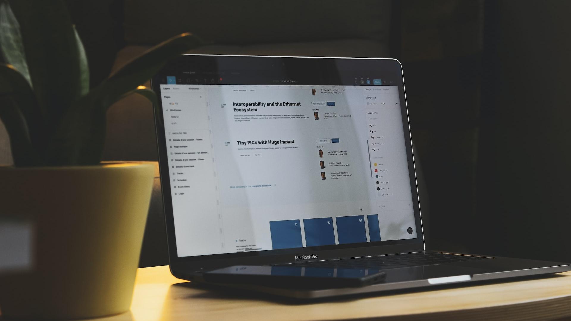 black tablet computer on brown wooden table